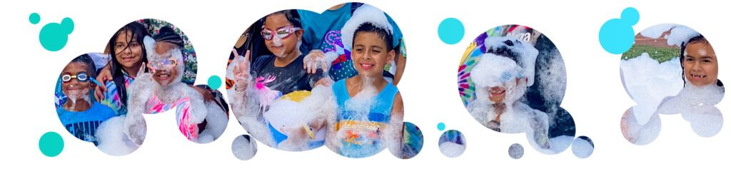 Foam parties for summer camps - an image of kids ages 5-10 wearing goggles and covered in foam while smiling